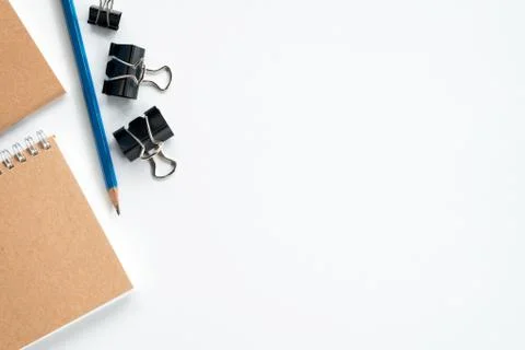 White student's desk table with notebooks and supplies. Top view with copy sp Stock Photos