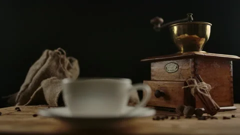 White stylish coffee cup standing on wood table. Camera focusing, rotating. Stock Footage 140365101