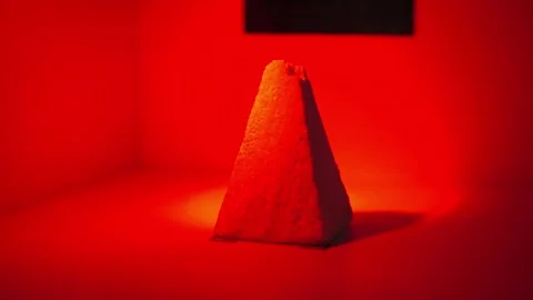 White Styrofoam Pyramid Is Illuminated In Different Colors Video stock 263344834