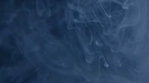 White Substance in the Form of Rings Floating in Darkness Stock Footage 115573894