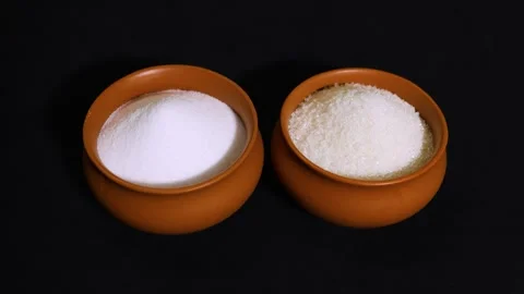 White sugar and table salt in clay bowls isolated on black background Stock Footage 336646048