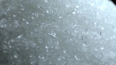 White sugar on a black background. Close-up slow motion macro.  Stock Footage 228122259