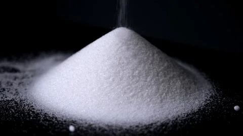 White Sugar Crystals Pouring onto a Large Pile Stock Footage 336706952