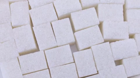 White sugar cubes circle rotation close up top view Stock Footage 242773860
