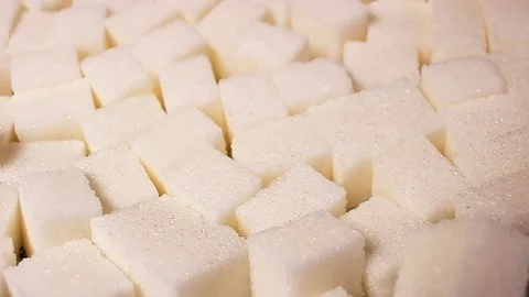 White sugar cubes. Lump sugar cube rotating pattern macro texture background Stock Footage 91380641