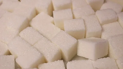 White sugar cubes. Lump sugar cube rotating pattern macro texture background Stock Footage 91380761