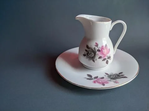 White sugar cup with motif isolated over gray background Stock Photos
