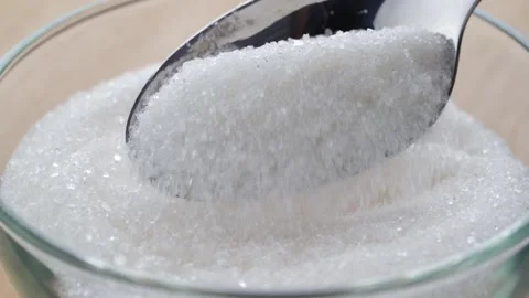 White sugar is digested in a bowl and spooned 스톡 동영상 160838081