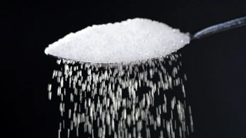 White sugar falling from tea spoon in slow motion Stock Footage 115631567