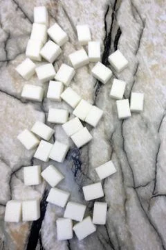 White sugar on marble table space spoon . Stock Photos