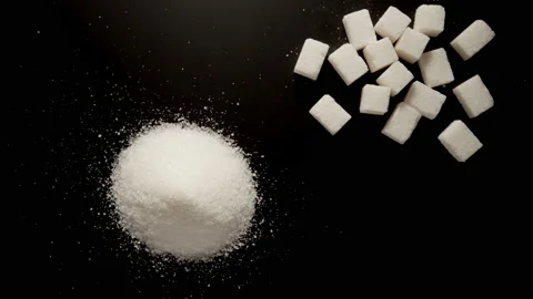 White sugar is piled up on the black table, stop motion 動画素材 145931452