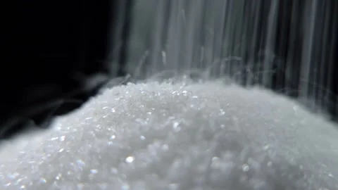 White sugar poured on a table on a black background Stock Footage 147088113