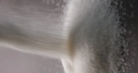 White sugar pouring slow motion in studio 4K pro res vertical Stock Footage 273636399