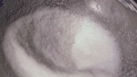 White sugar-like powder falling from a funnel Stock Footage 169170841