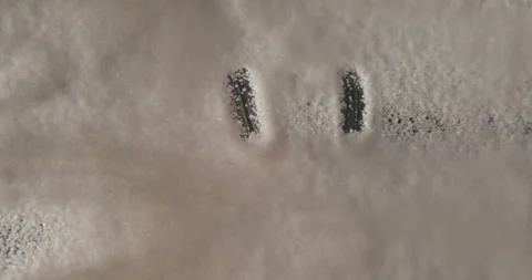 White sugar smiley drawing from below 4K pro res Stock-Footage 274906934
