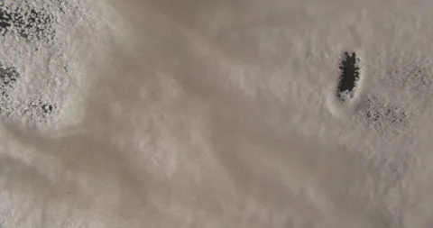 White sugar smiley drawing from below 4K pro res Stock-Footage 274906963