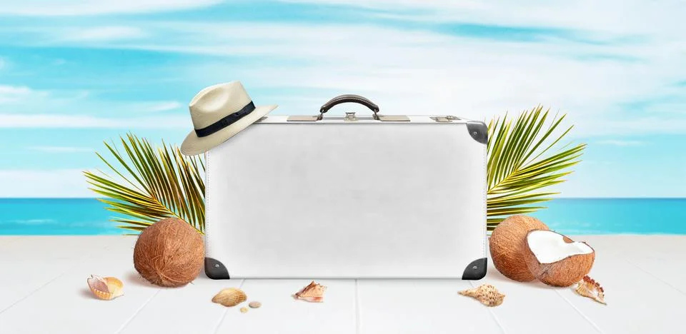 White suitcase with space for text or logo presentation surrounded by palm le Stock Photos