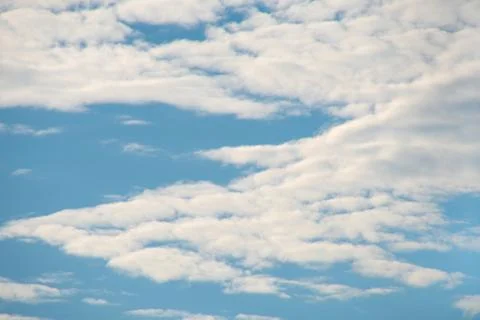 White summer clouds on blue Stock Photos