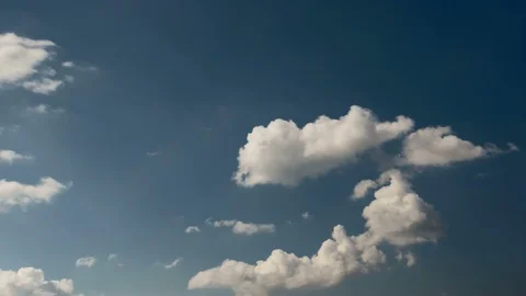 White summer clouds forming on blue sky Stock Footage 115614639