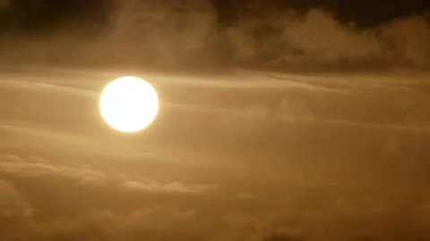 White sun, dark clouds - sunrise, sky background - Real Time - flying birds Stock Footage 152563218