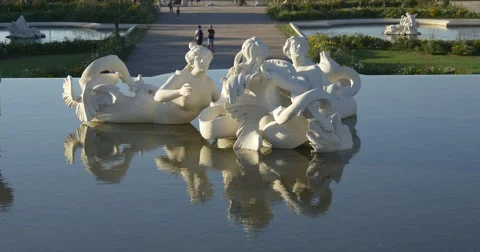 White sunlit statue with its reflection in water Stock Footage 66863267