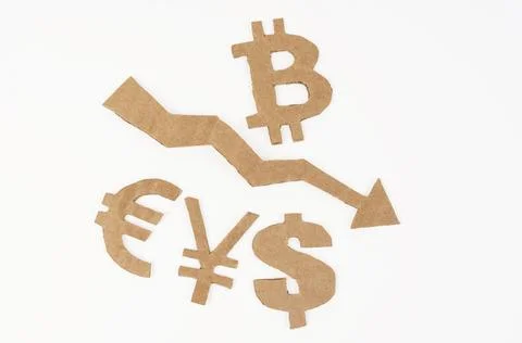 On a white surface, an arrow pointing down and symbols of bitcoin, dollar, eu Stock Photos