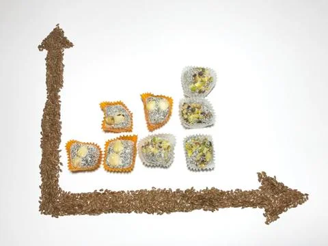 On the white surface, a coordinate axis is plotted with flaxseed. 写真素材