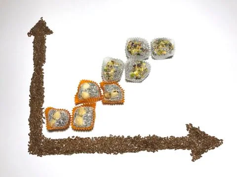On the white surface, a coordinate axis is plotted with flaxseed. 写真素材