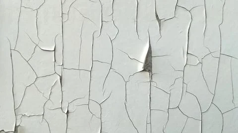 The white surface has weathered, cracks due to exposure to sunlight. 스톡 사진