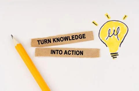 On a white surface, a luminous light bulb and pieces of paper with the insc.. Stock Photos