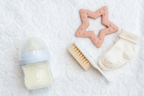 White surface presentation of baby essentials, top perspective with space Stock Photos