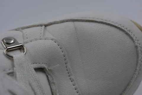 The white surface is stitched with white threads. Stock Photos