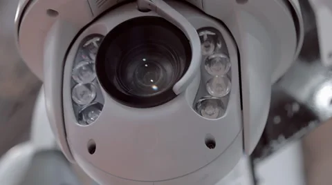 White surveillance camera rotates for checking the surrounding area 스톡 동영상 64736298