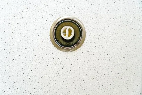 White suspended ceiling with built-in round LED lighting. Close-up details of Stock Photos