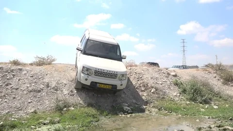 White suv crossing in water Stock Footage 82415537