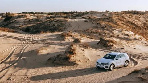 White SUV in desert. Stock Photos