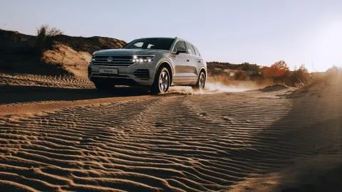 White SUV in desert Stock Photos