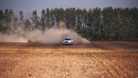 White SUV drifting in the field. Stock Footage 78634411