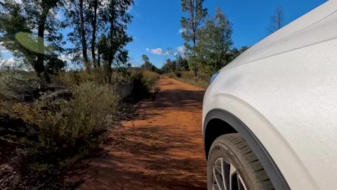 White SUV Driving on Red Dirt Track in The Pilliga Stock Footage 345012509