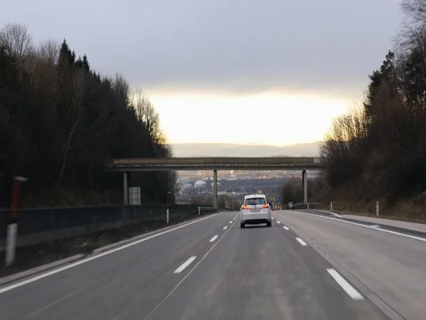 White SUV in motion on highway. Video stock 79987747
