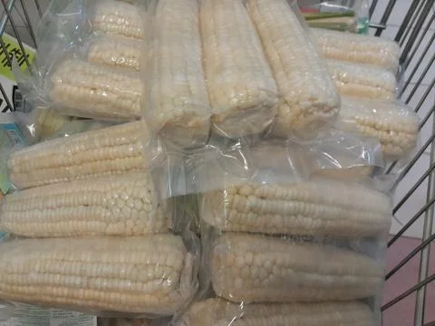 White Sweet Corn vegetable in plastic pack Stock Photos