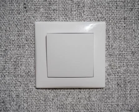 White switch on the gray wall 写真素材