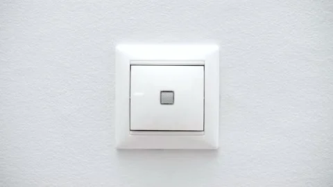 White switch on a light wall. Stock Footage 145435932
