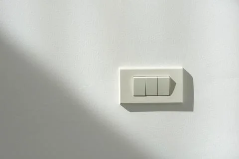 White switch power on a white wall Stock Photos