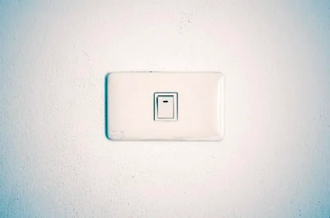 White switch on wall Stock Photos