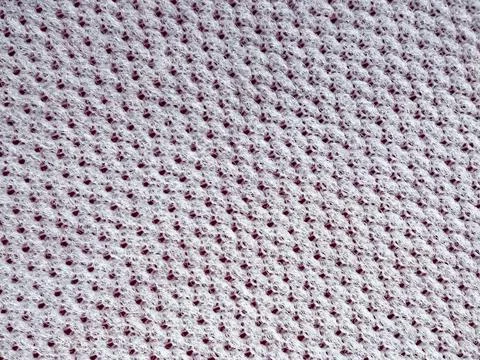 White synthetic lining as a base under red leatherette Stock Photos