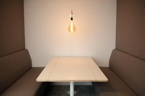 White table and two brown sofas at the meeting room Foto stock