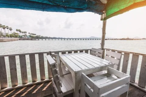 White table on beach terrace Stock Photos