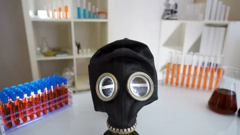 The white table with the black hazard mask with the coronavirus or Covid-19 Stock Footage 129345045