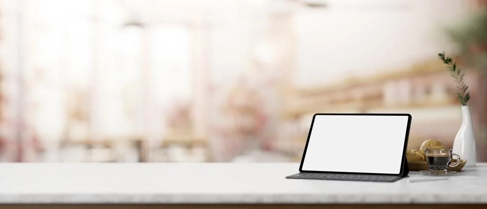 A white table features a digital tablet mockup, a coffee cup, and bread on .. Stock Illustration